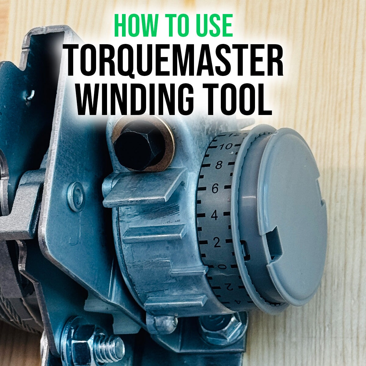Installer using TorqueMaster Plus Winding Tool on Wayne Dalton spring system