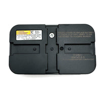 Backside of Genie Garage Door Remote showing battery compartment