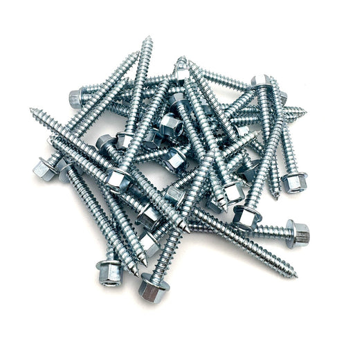 Overhead perspective of multiple 3-inch zinc lag screws with a 7/16'' hex head, arrayed neatly