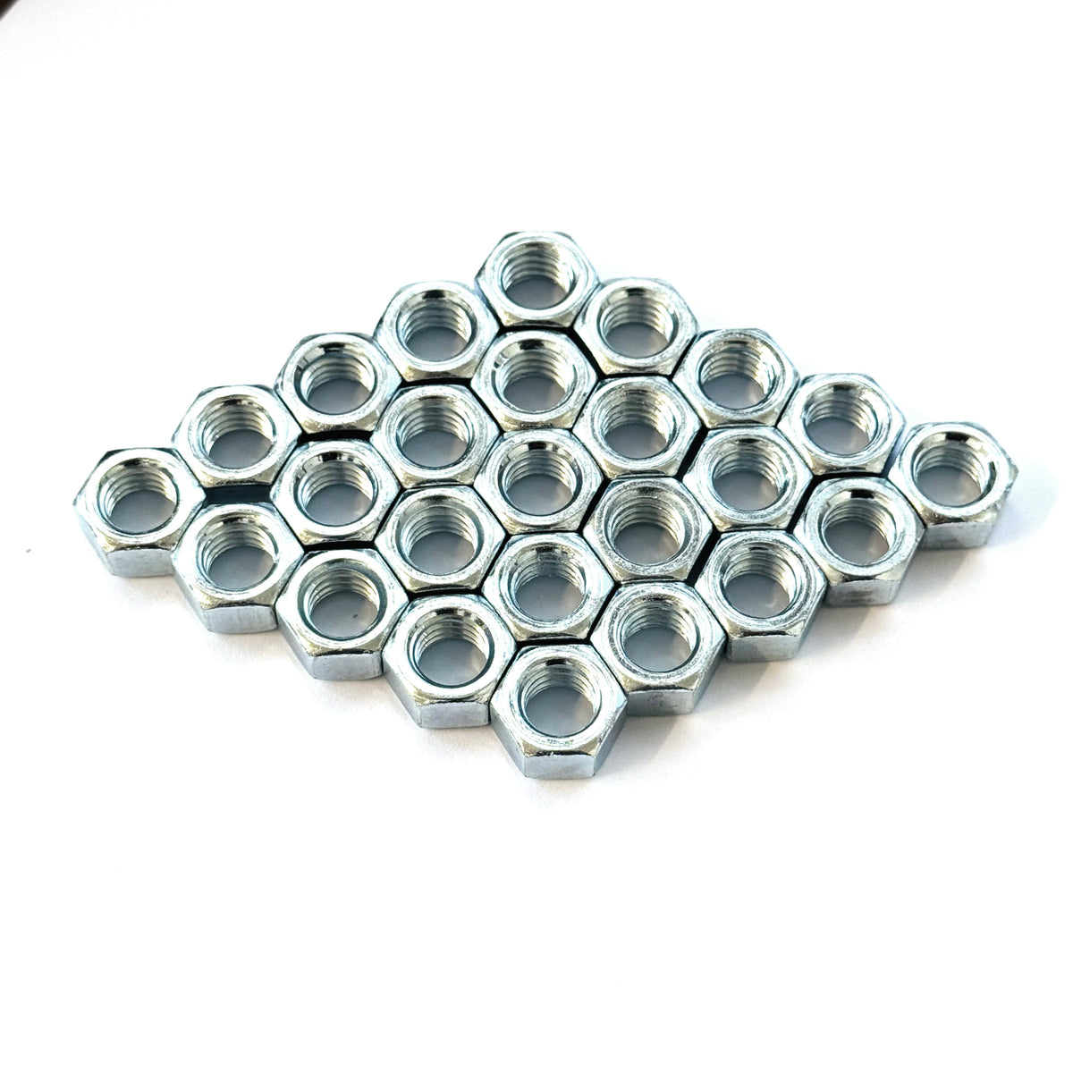 Flat display of finished hex nuts zinc plated for corrosion resistance and durability