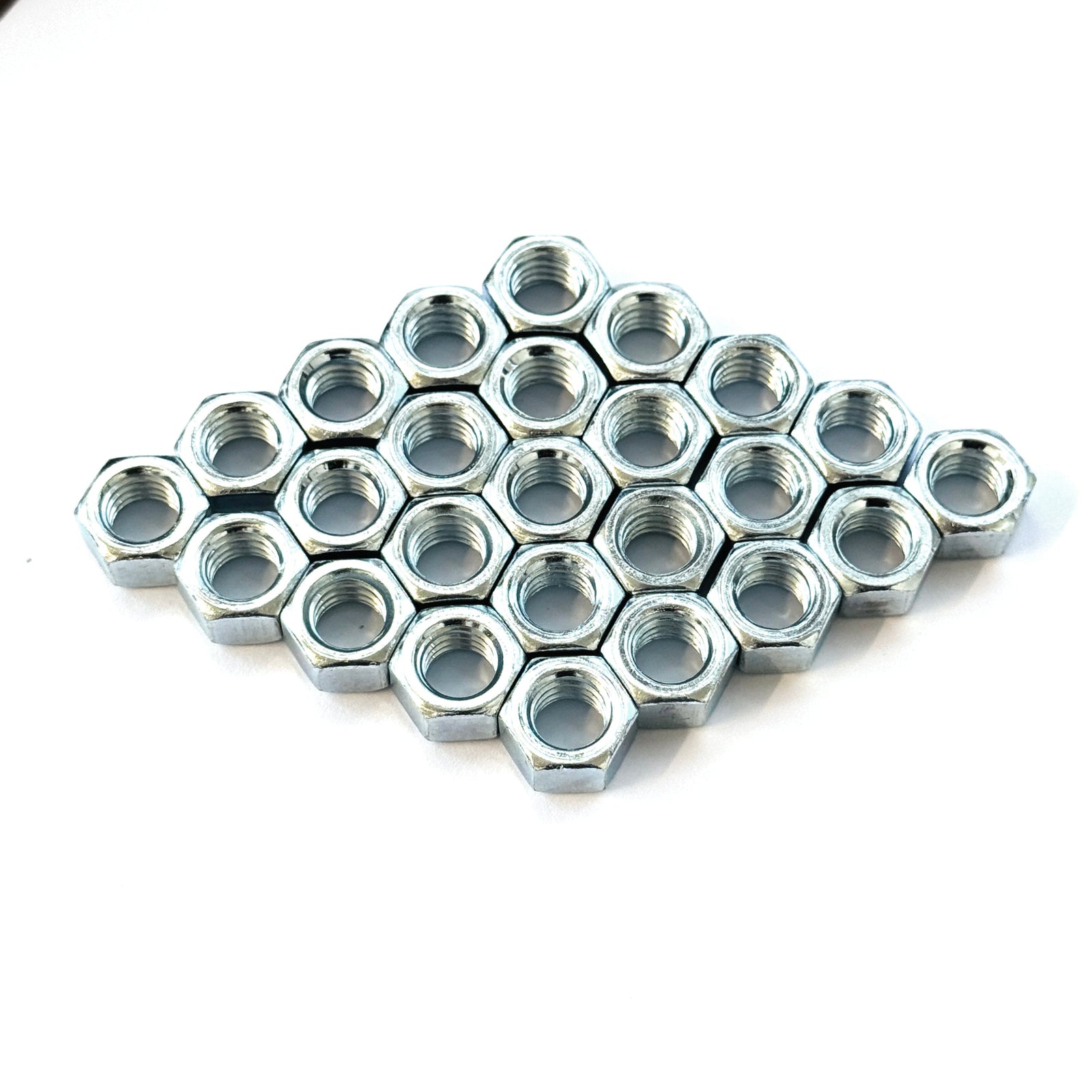Flat display of finished hex nuts zinc plated for corrosion resistance and durability